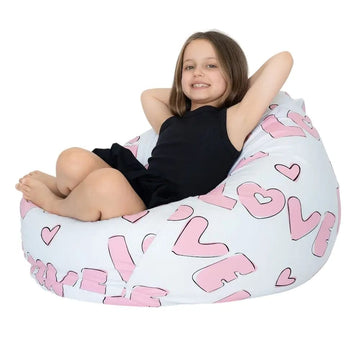 Child sitting inside a bean bag with 'LOVE' and heart patterns on a white background