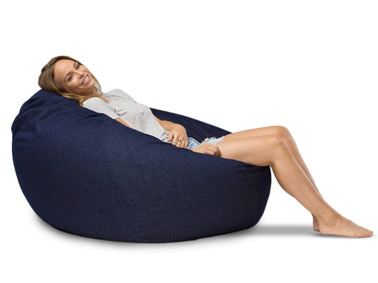 lady sitting on a large blue denim bean bag