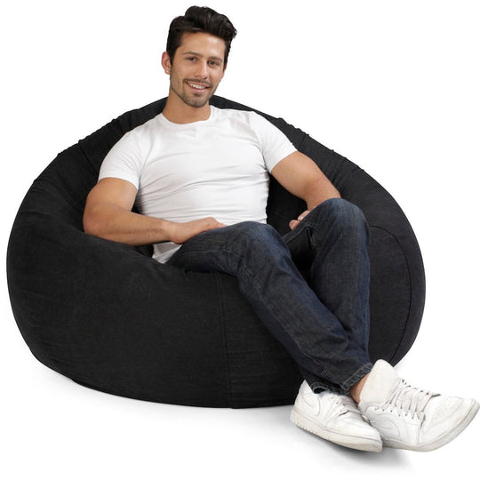 cuba denim beanbag chair 120cm indigo with man seated in a white t-shirt
