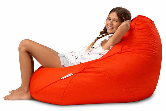 girl sitting on a bright red kids bean bag chair