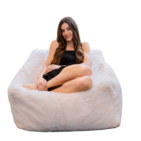 furry white fur bean bag with lady posing